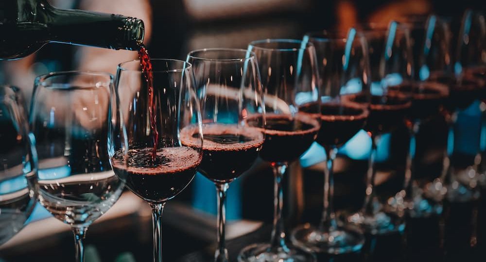 red wine glass line up .