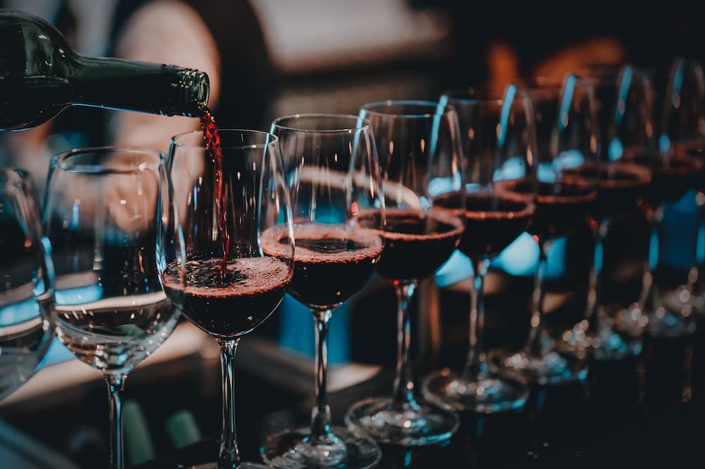red wine glass line up .